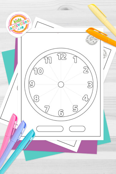 Black and white coloring pages of a printable clock face lying on top of blue-green and purple sheets with assorted markers on a light grey background.