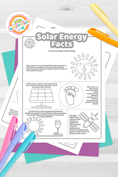Black and white coloring pages with facts about solar energy lying on top of blue-green and purple sheets with assorted markers on a light grey background.