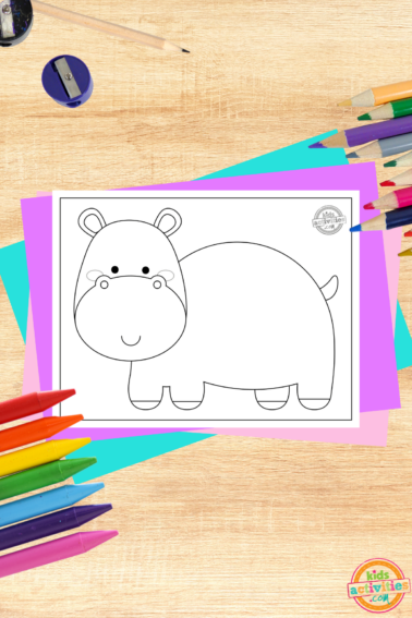 Free Printable Hippopotamus coloring page printed pdf on wood background with coloring supplies- kids activities blog
