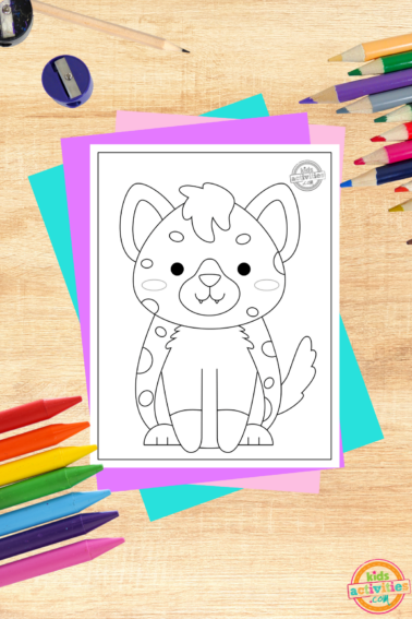Free printable hyena printed pdf on wooden background with coloring supplies- kids activities blog